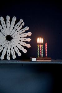 Winter decoration with burning candles on matchbox Winter decoration with burning candles on matchbox
